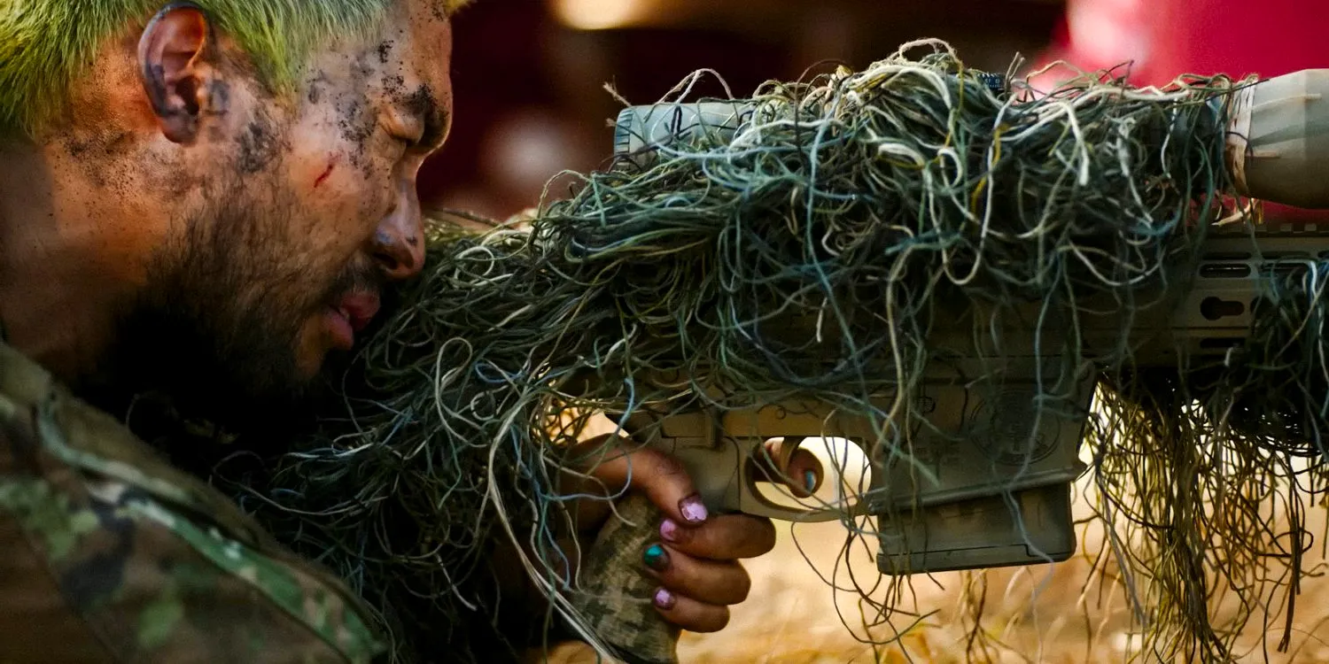 Jin Ha as a sniper with his rifle covered with some moss for camouflage in Civil War Image