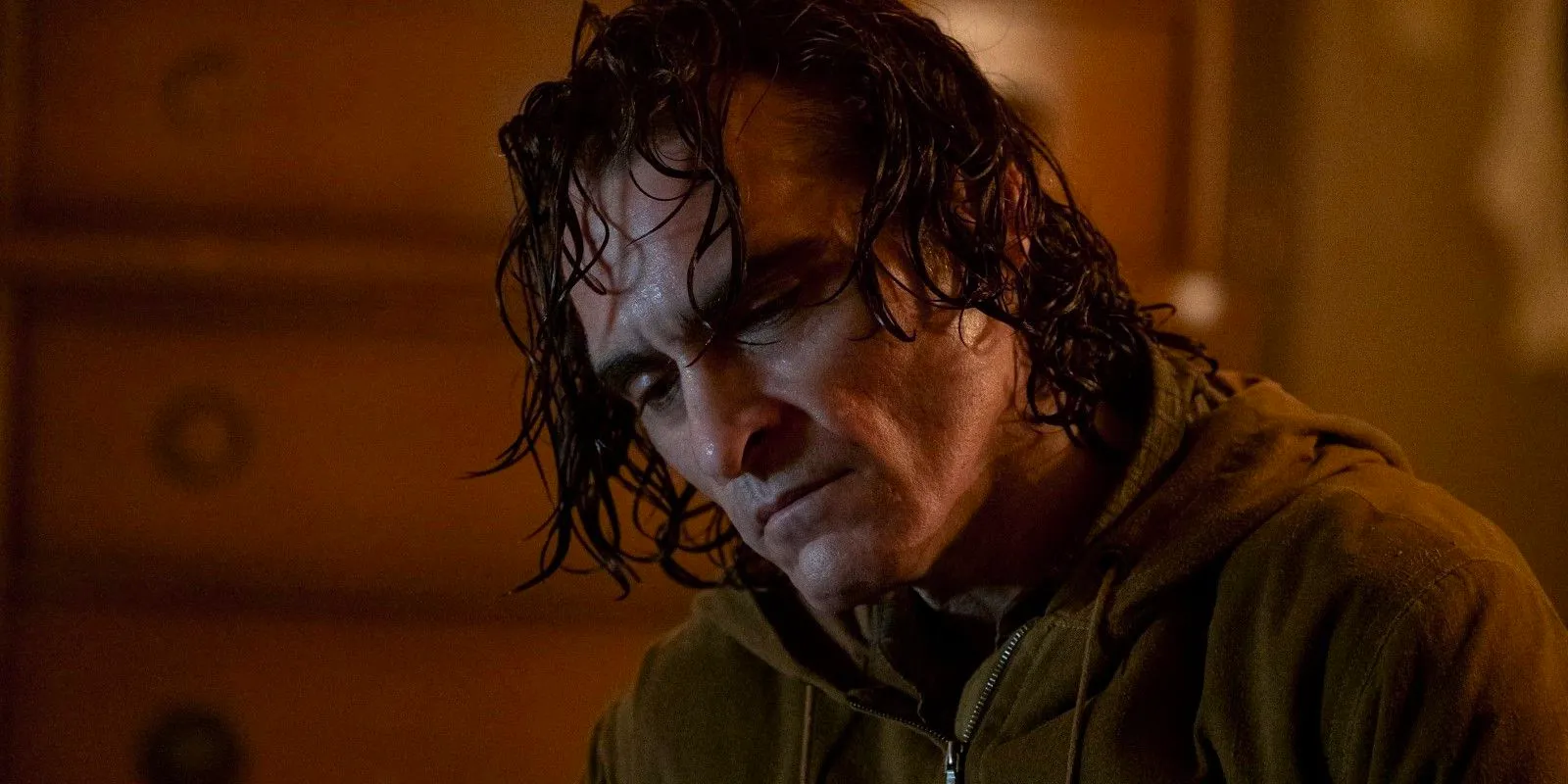 Joaquin Phoenix as Arthur in Joker movie looking sad Image