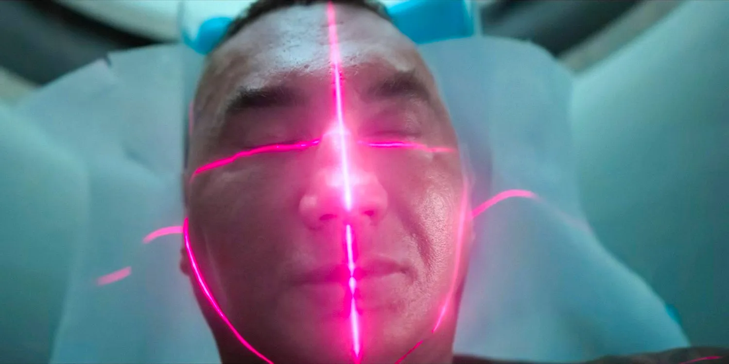 Joe Flood (Dave Bautista) undergoing an MRI scan in The Killer's Game (2024) Image