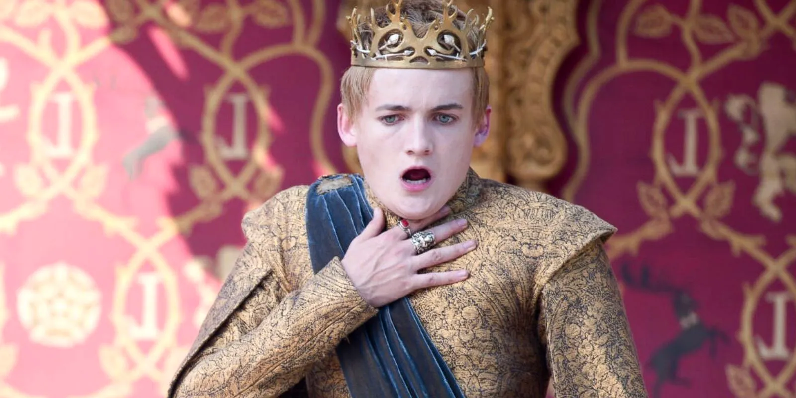 Joffrey holding his throat as he chokes in Game of Thrones Image