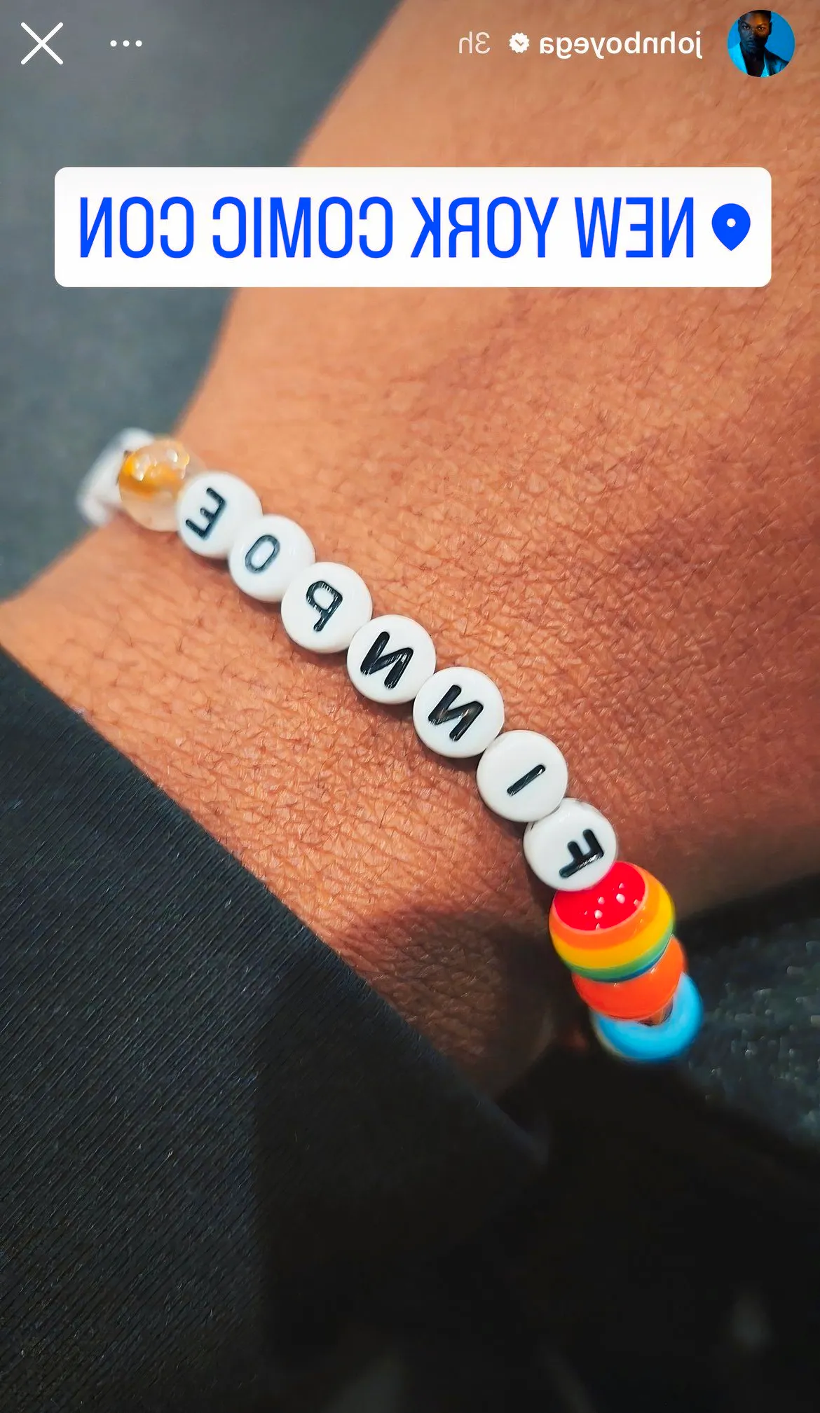 John Boyega's Instagram story of a Finnpoe bracelet, celebrating the Star Wars sequel trilogy. Boyega's wrist is captured wearing a friendship bracelet that says 