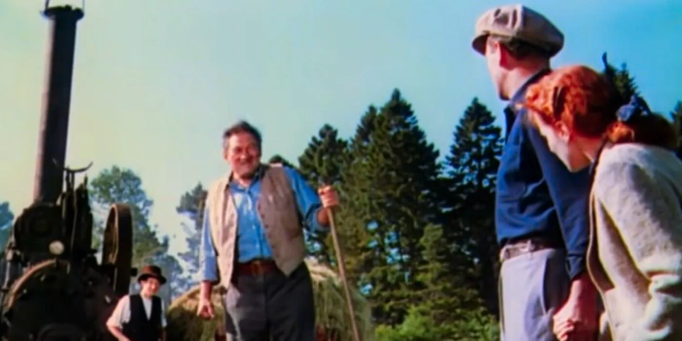 John Wayne as Sean Thornton & Maureen O'Hara as Mary Kate Danaher looking at an Irish farmer in The Quiet Man (1952)  Image