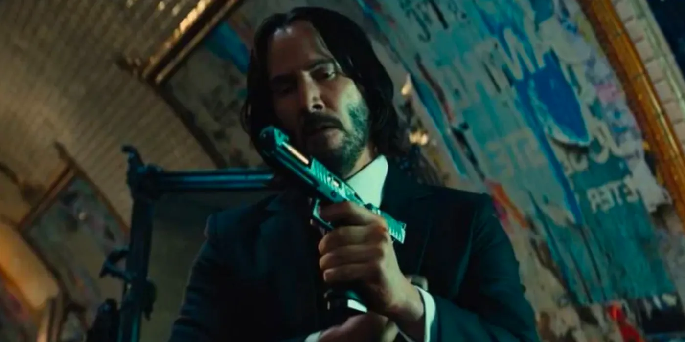 John Wick holds a gun in John Wick Chapter 4 Image