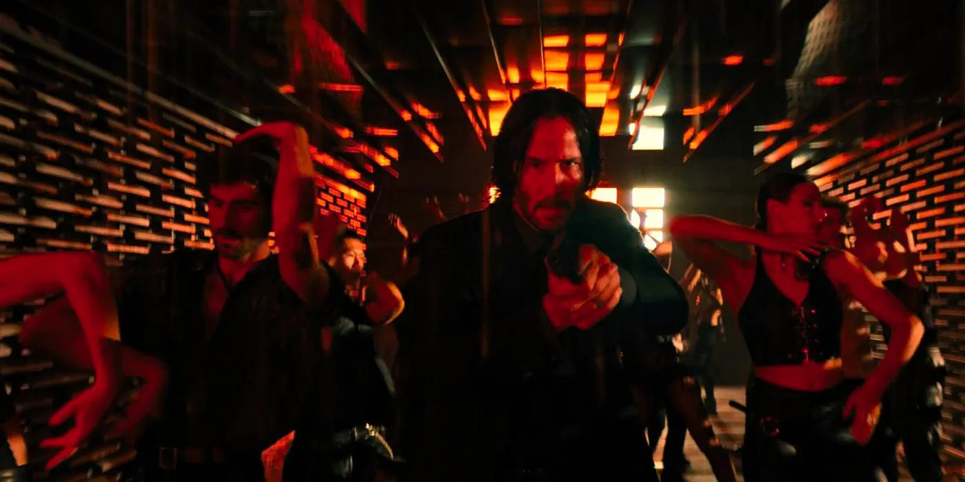 John Wick with a gun in the The Club Himmel und Hölle. Image