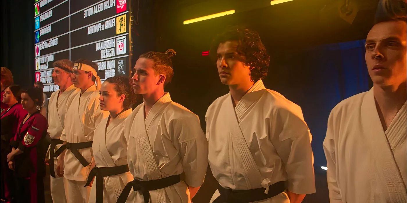 Johnny and Daniel's students stand on the sidelines at the Sekai Taikai in Cobra Kai season 6 Image