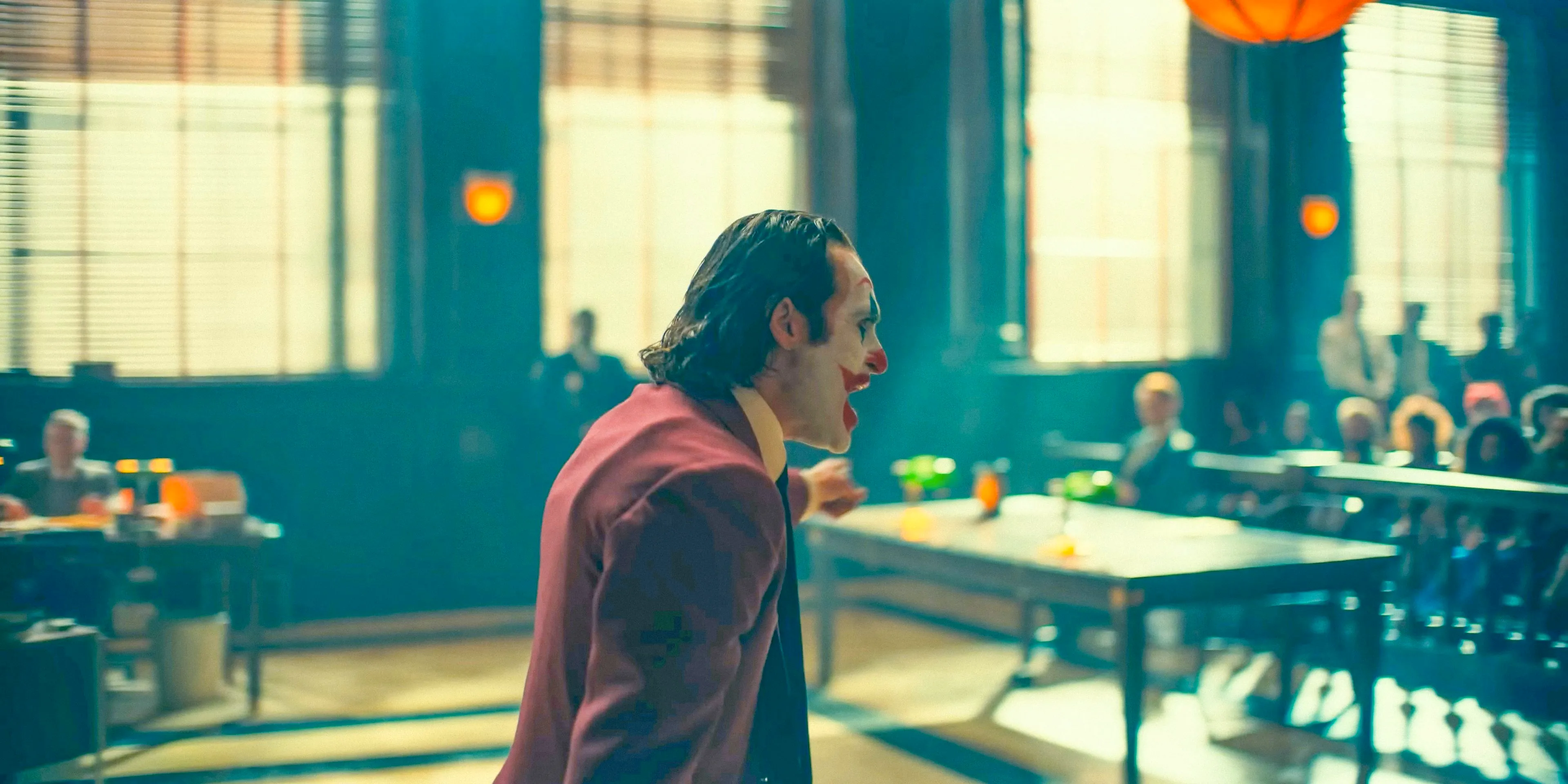 Joker (Joaquin Phoenix) angry, yelling in the courtroom in Joker: Folie à Deux Image