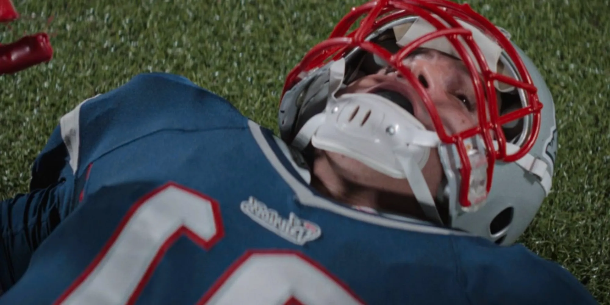 Josh Rivera on the ground as Aaron Hernandez in American Sports Story Image