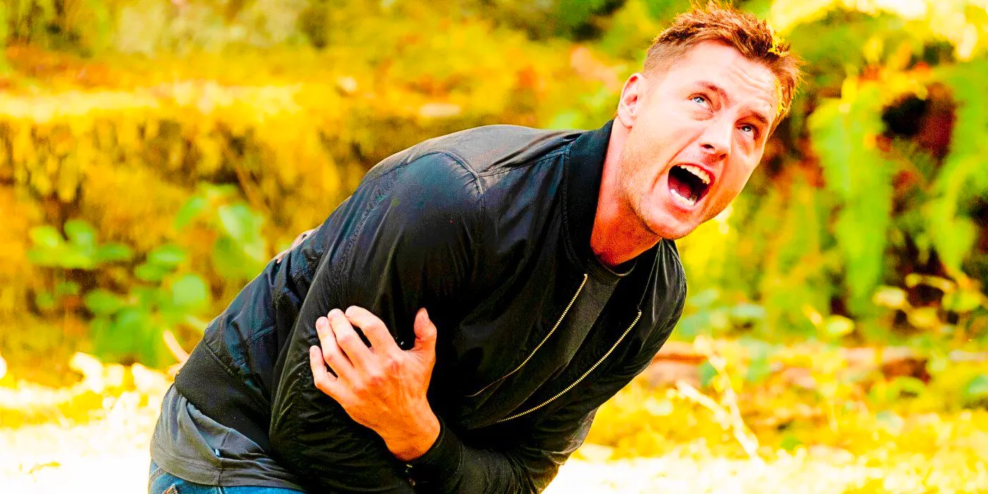 Justin Hartley as Colter Shaw holding his arm and yelling in Tracker Image