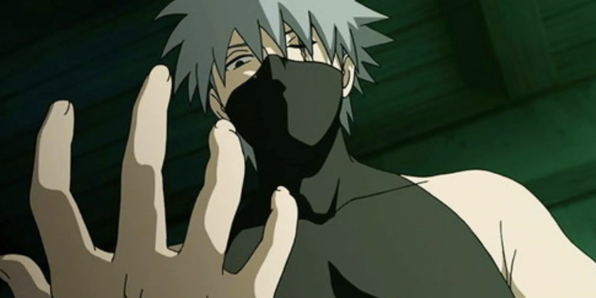 Kakashi from Naruto anime looks down at his hand in Shadow Of The Black Anbu episode. Image