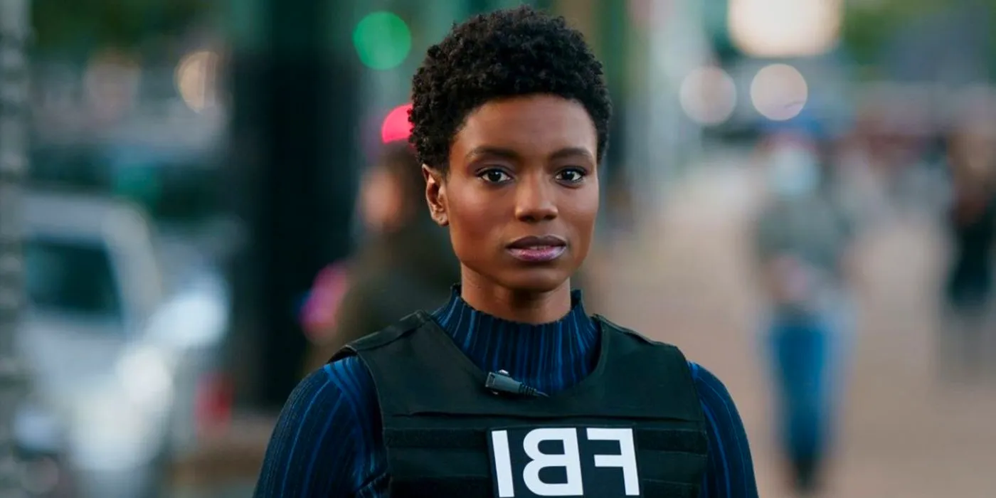 Katherine Renee Turner as Tiffany Wallace in her FBI vest Image