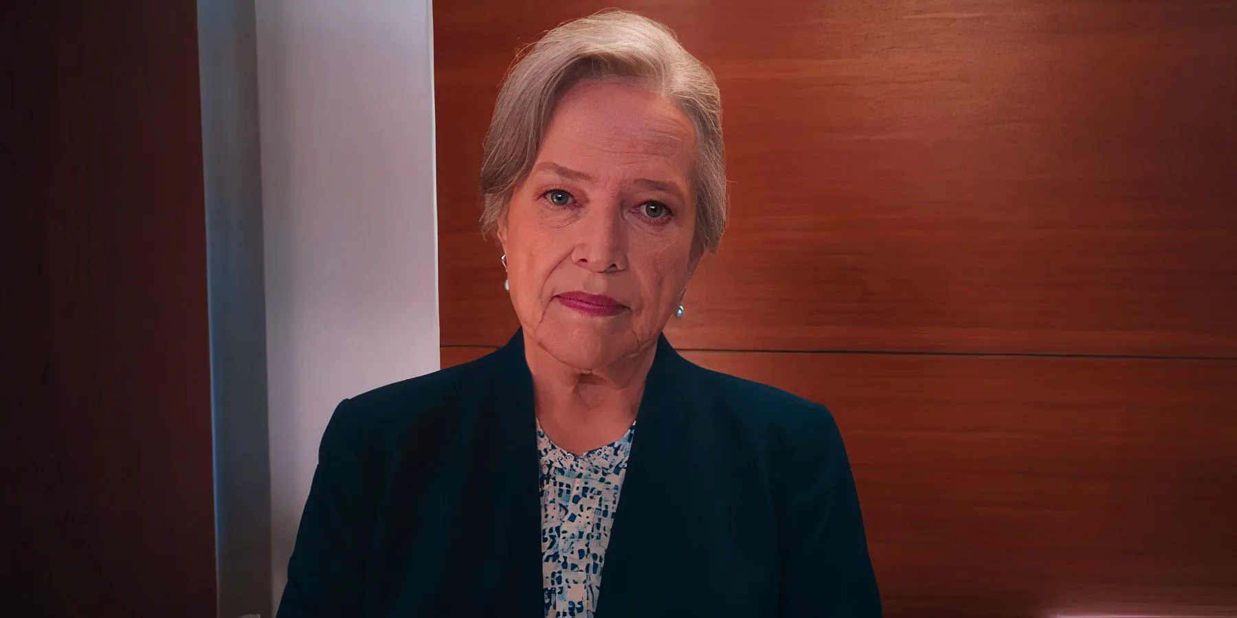 Kathy Bates as Matlock in an elevator looking serious in Matlock Image