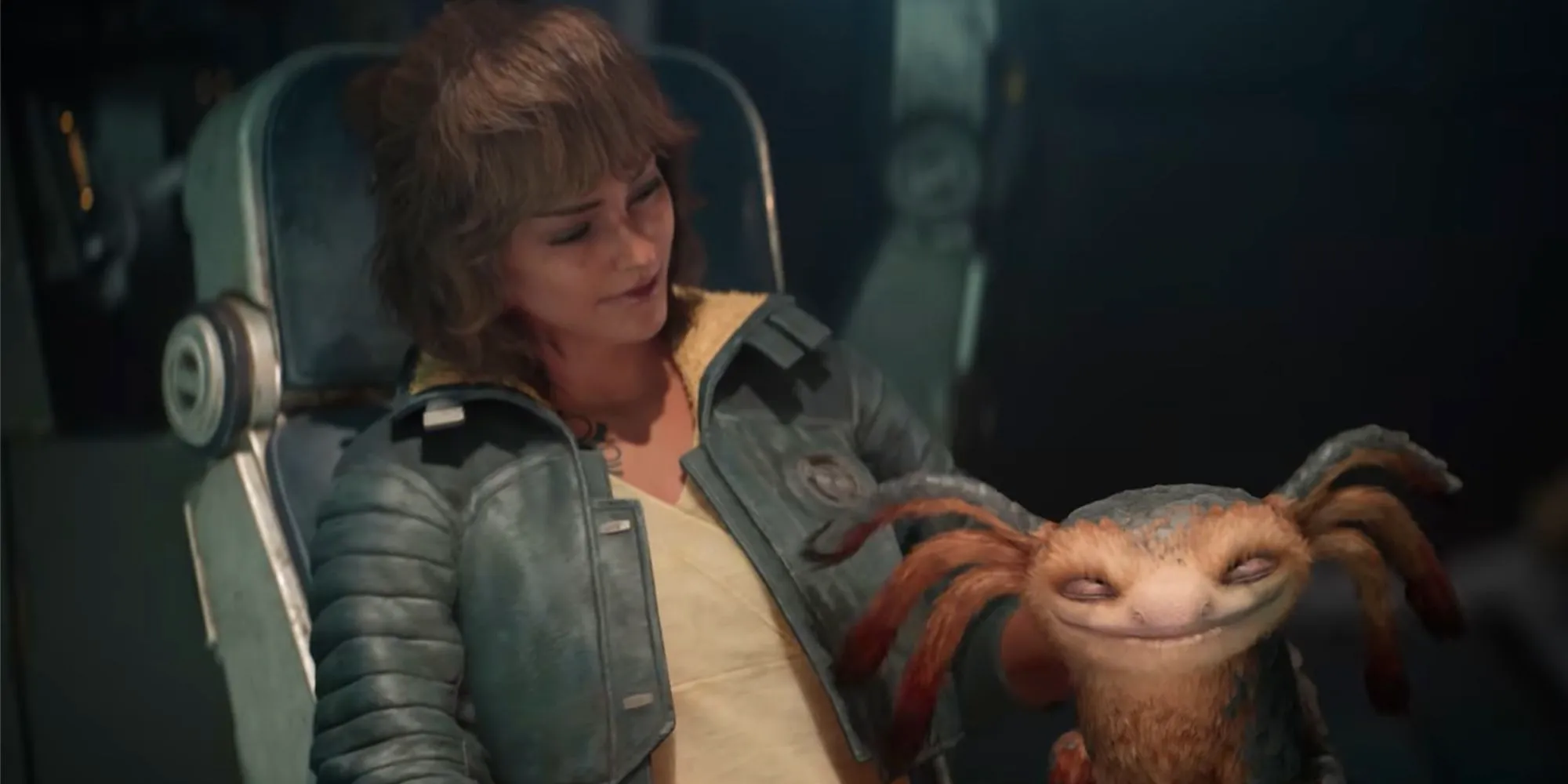 Kay petting Nix in the Trailblazer in Star Wars Outlaws. Image