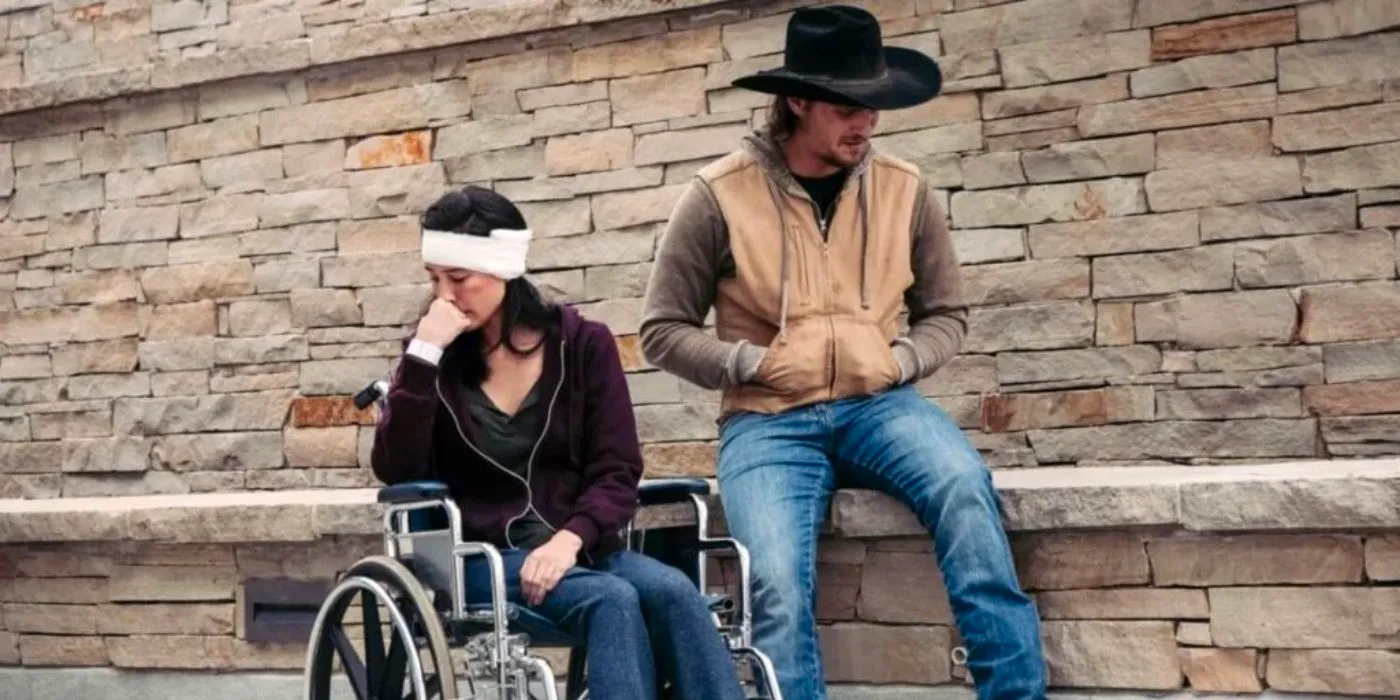 Kayce (Luke Grimes) and Monica (Kelsey Asbille) having a fight while Monica is in a wheelchair in Yellowstone. copy Image