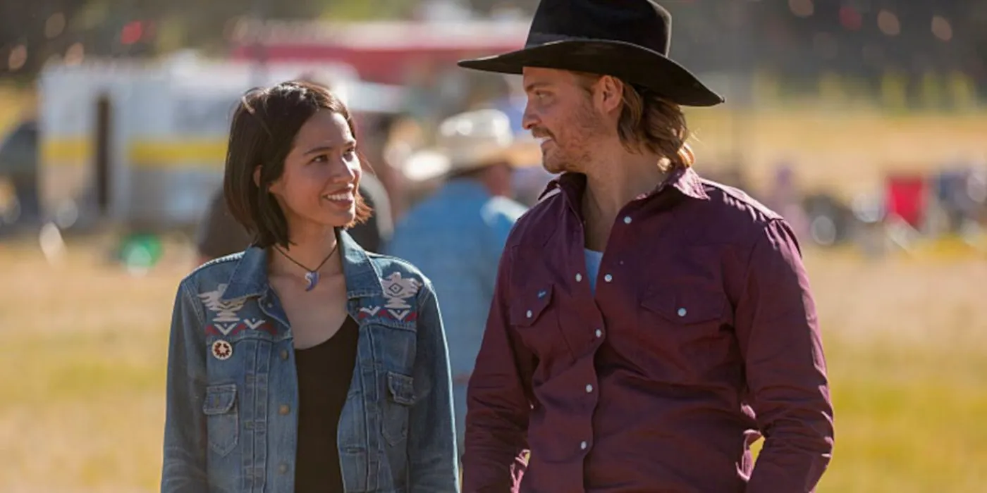 Kayce (Luke Grimes) smiling at Monica (Kelsey Asbille) in Yellowstone. Image