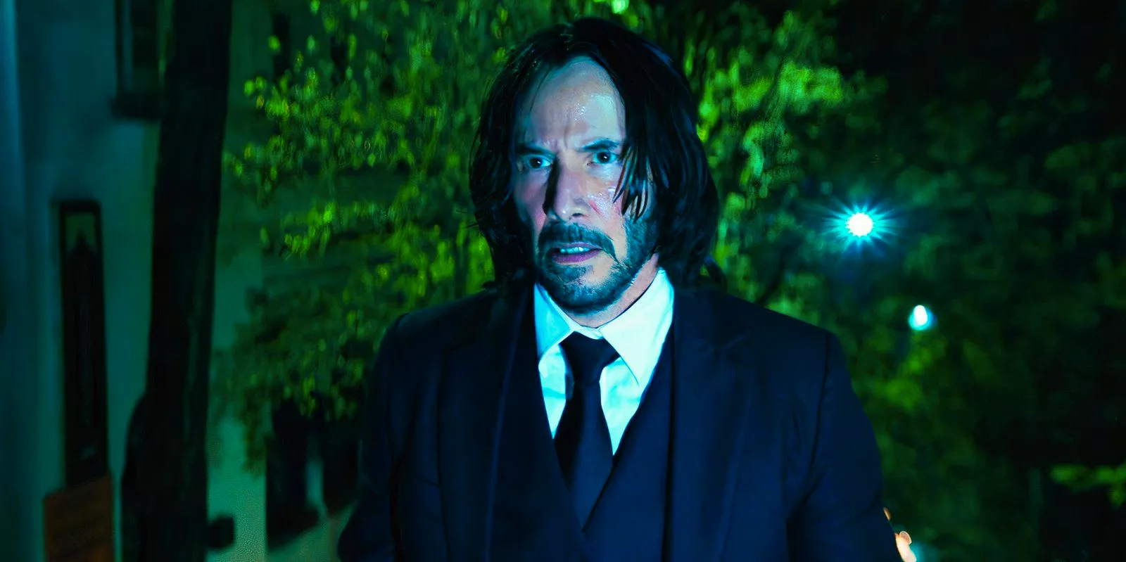 Keanu Reeves looking surprised as John Wick in John Wick Chapter 4 Image