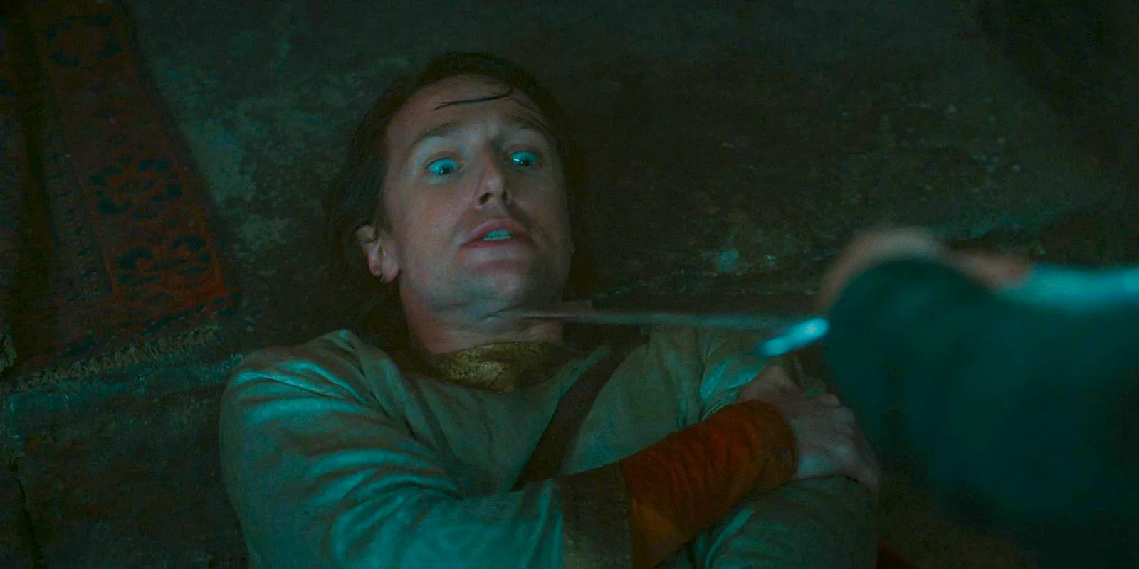 Kemen (Leon Wadham) being threatened with a sword by Valandil in The Lord of the Rings: The Rings of Power Season 2 Episode 5 Image