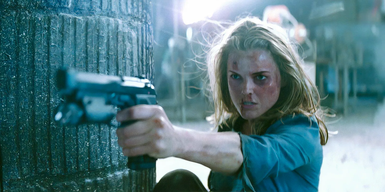 Keri Russell pointing a pistol as Lindsey Farris in Mission Impossible 3 Image