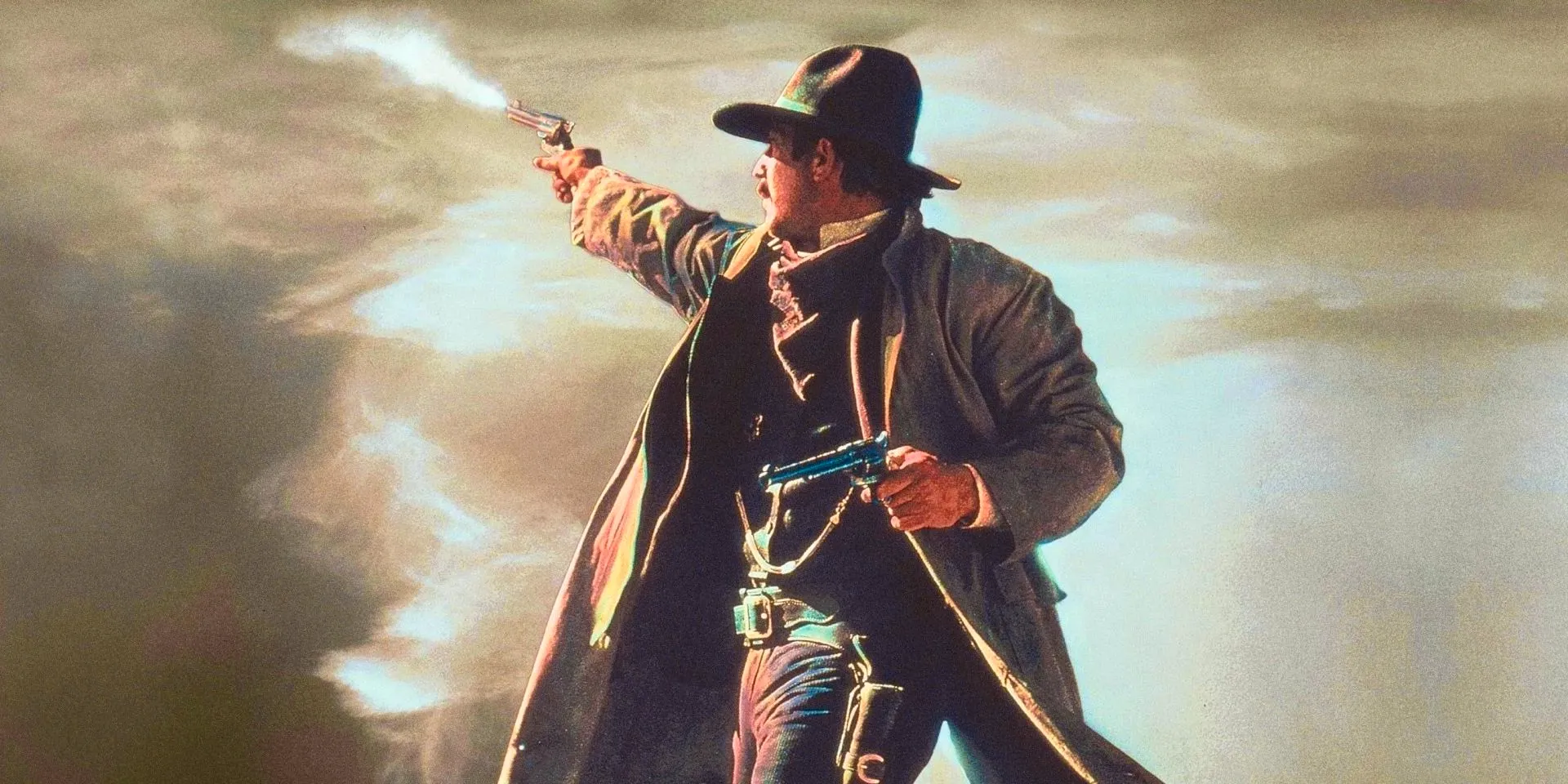 Kevin Costner as Wyatt Earp Shoots a Pistol Into the Distance in Wyatt Earp 1994 Image