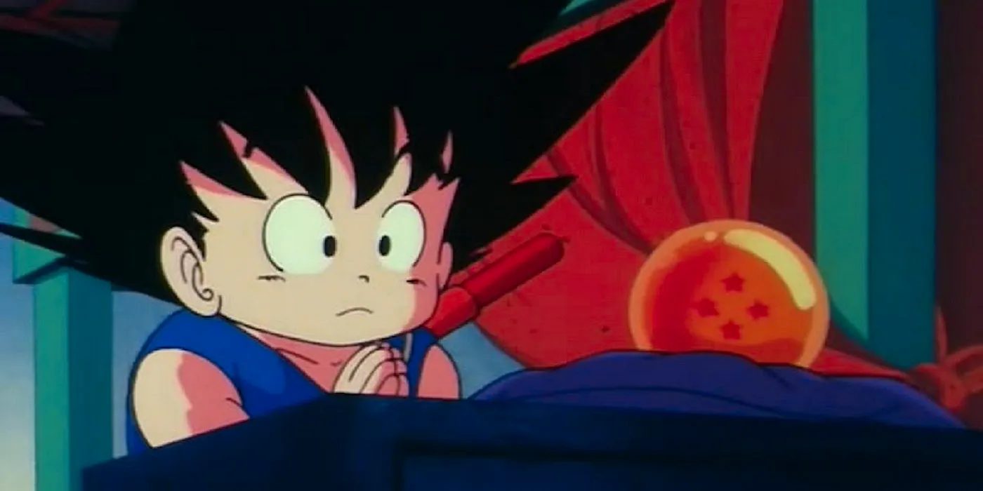 Kid Goku looks apprehensive as he prays to the four star dragon ball. Image