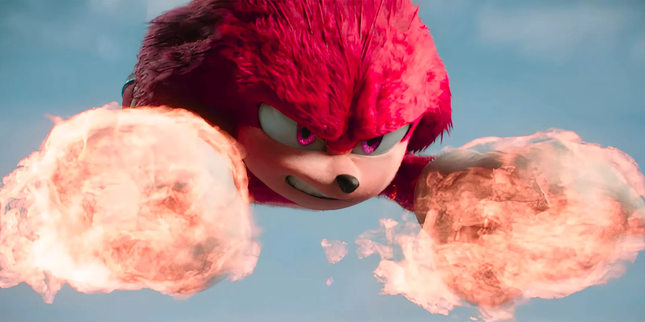 Knuckles flying through the air with fiery fists in Sonic the Hedgehog 3 Image