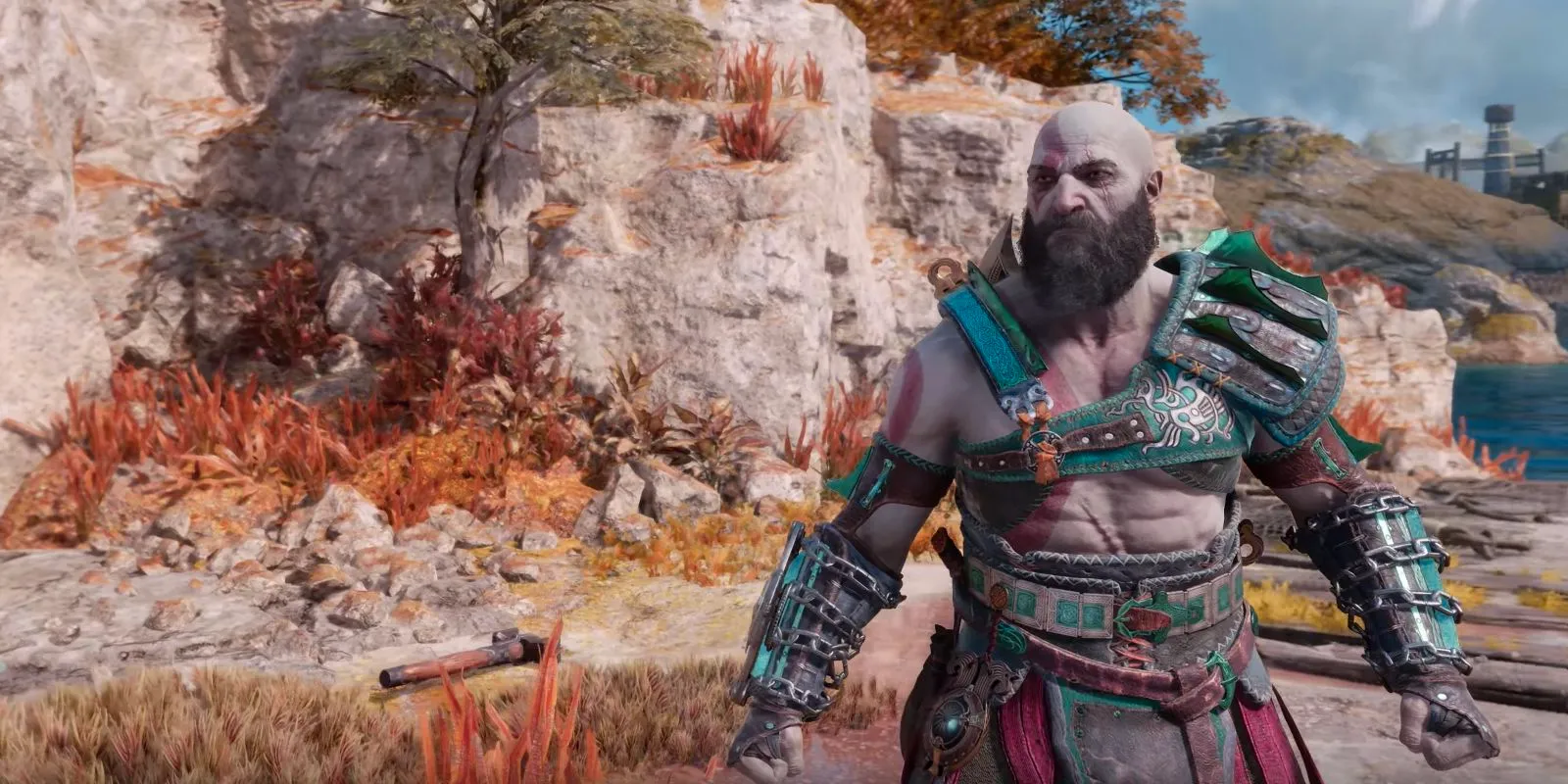 Kratos dressed in Mani's Wisdom, an armor set in God of War Ragnarok. Image