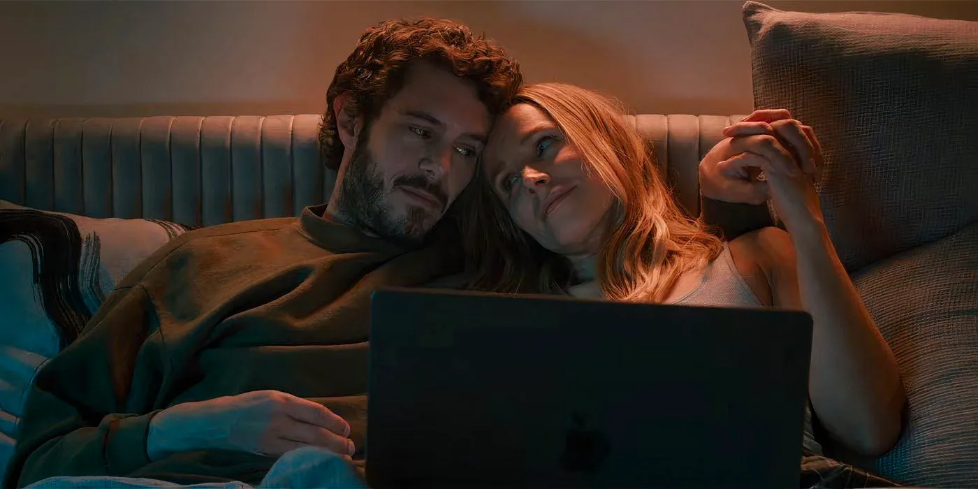 Kristen Bell and Adam Brody on the couch in Nobody Wants This Image