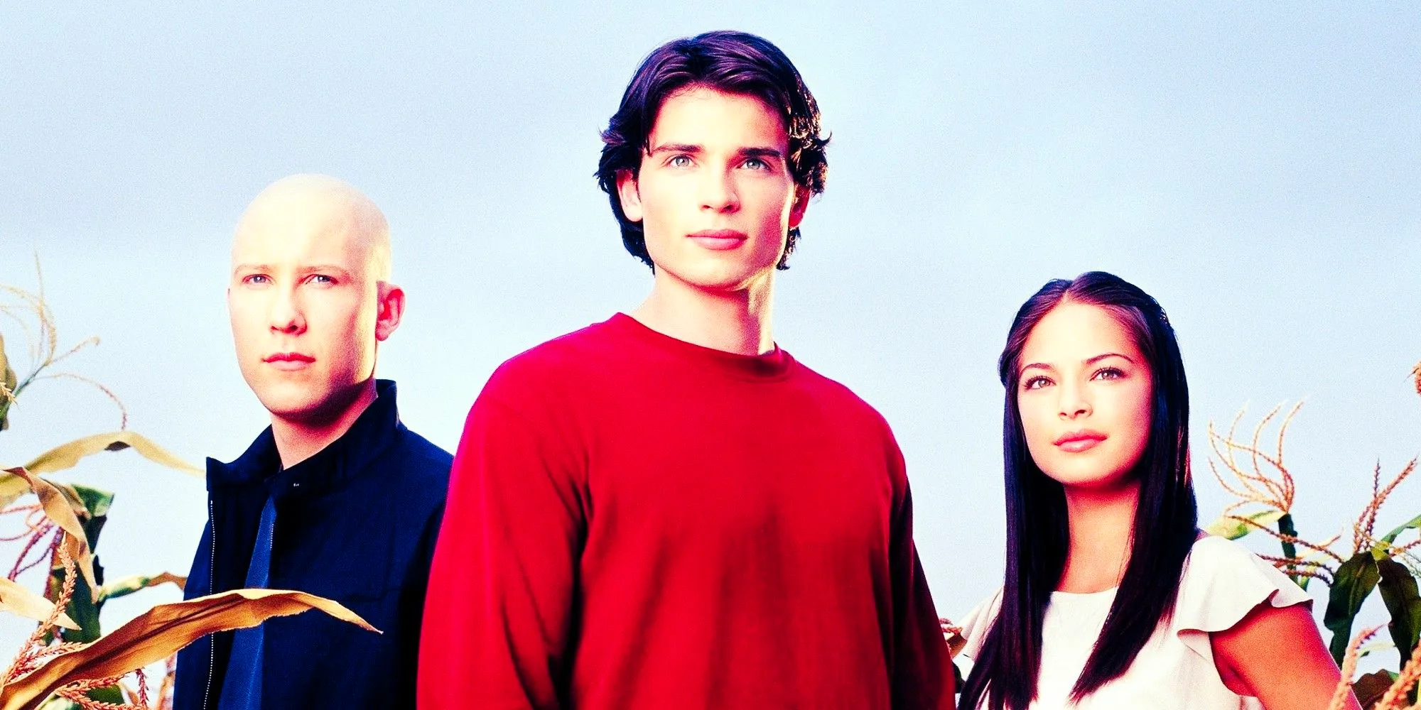 Kristin Kreuk As Lana Lang Tom Welling As Clark Kent And Michael Rosenbaum As Lex Luthor Standing In A Cornfield In Smallville Image