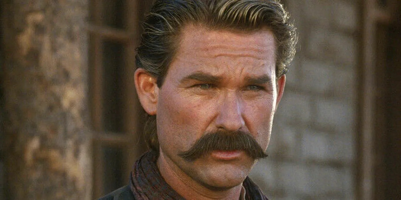 Kurt Russell as Wyatt Earp looking on in Tombstone Image