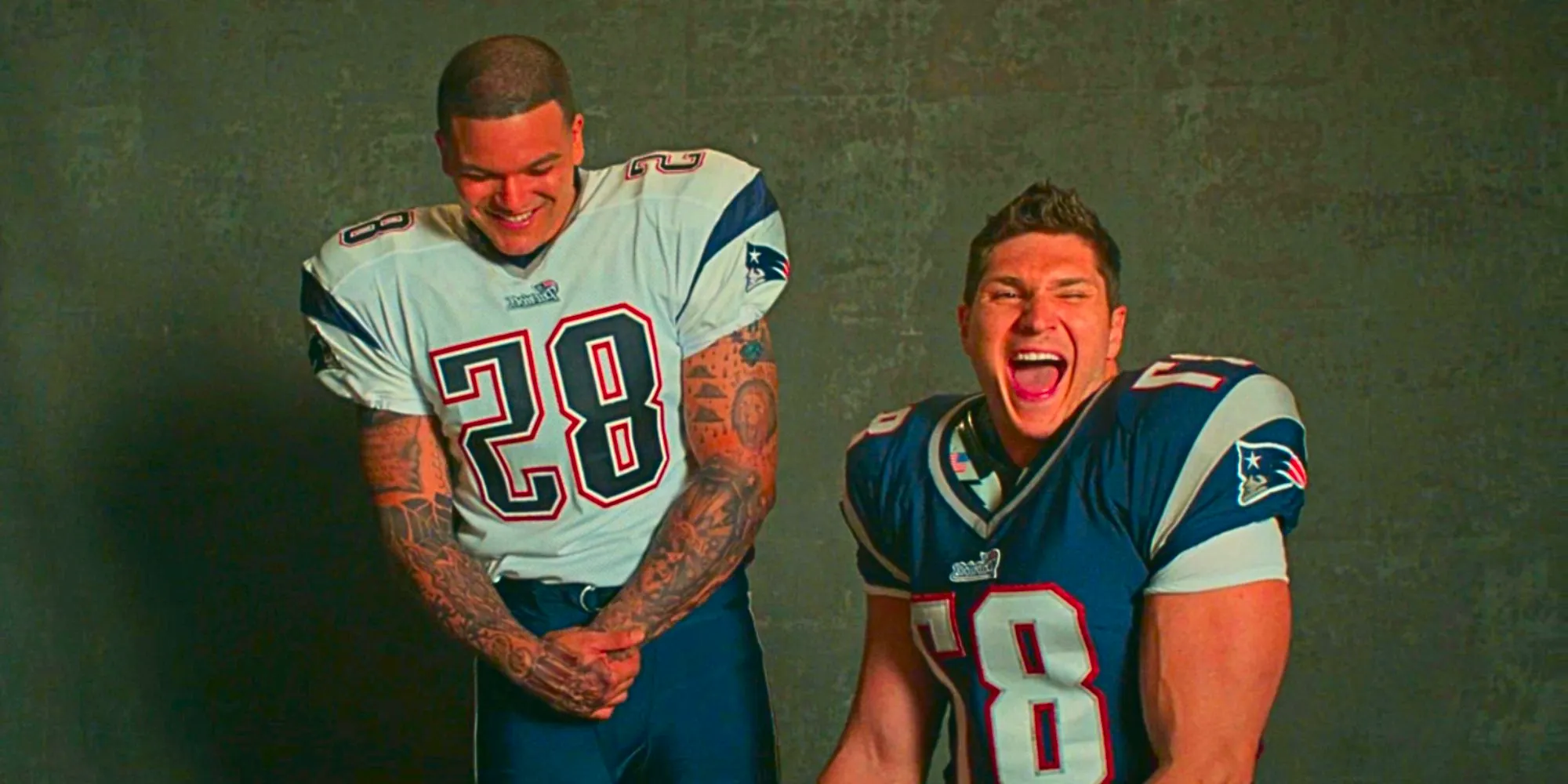 Laith Wallscheleger laughing as Rob Gronkowski as Josh Rivera smiles as Aaron Hernandez in American Sports Story Image