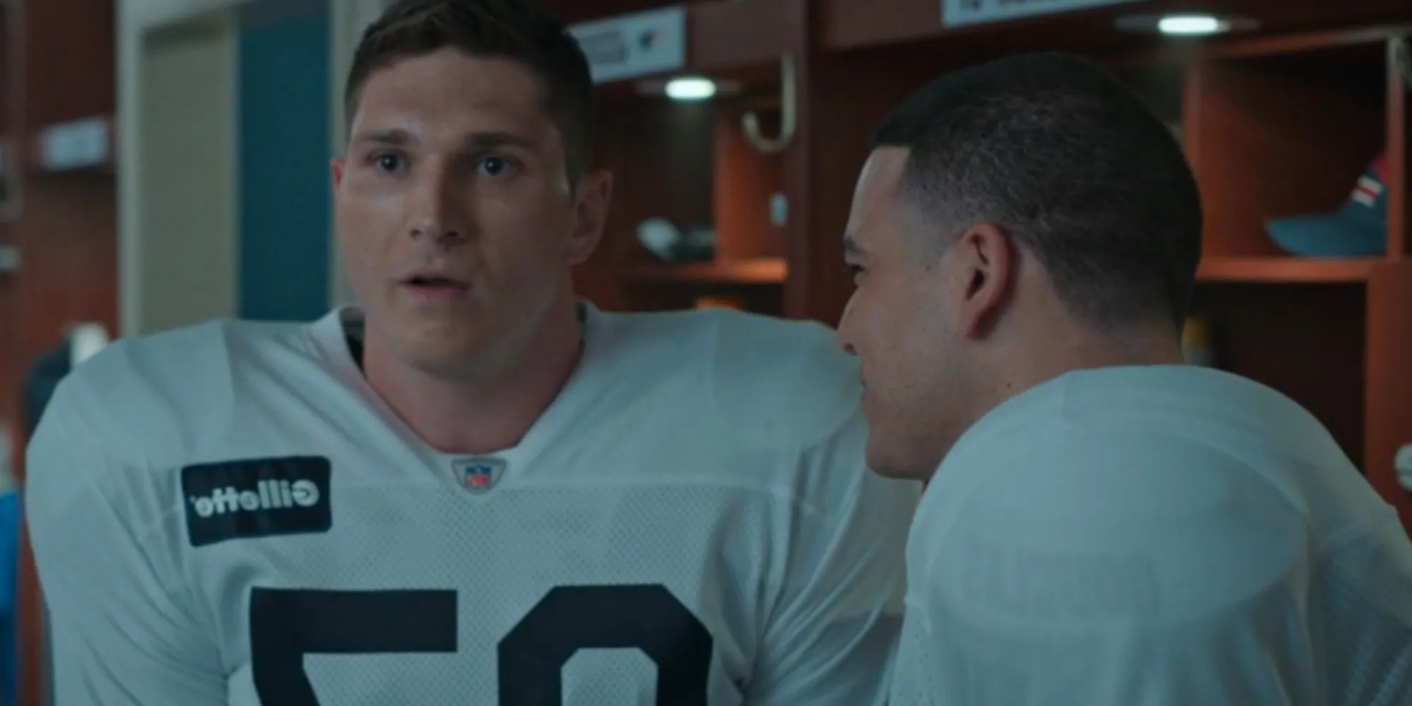 Laith Wallscheleger staring ahead as Rob Gronkowski as Josh Rivera smiles as Aaron Hernandez in American Sports Story Image