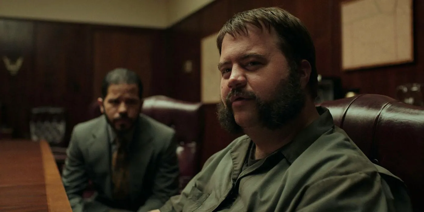 Larry Hall sitting in court in a scene from Black Bird. Image