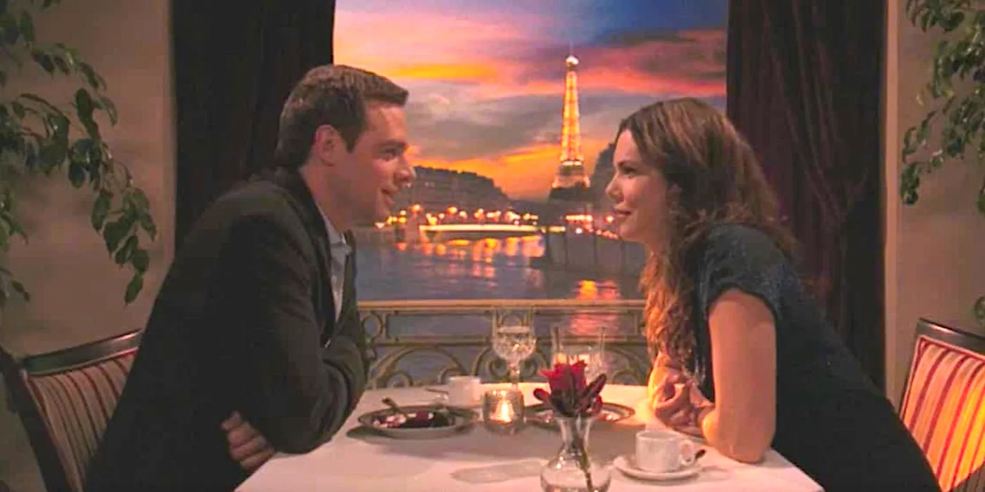 Lauren Graham's Lorelai and David Sutcliffe's Christopher sit at a dinner table in Paris from Gilmore Girls Image