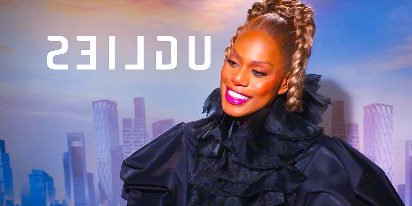 Laverne Cox smiling during Uglies interview with cityscape in background Image