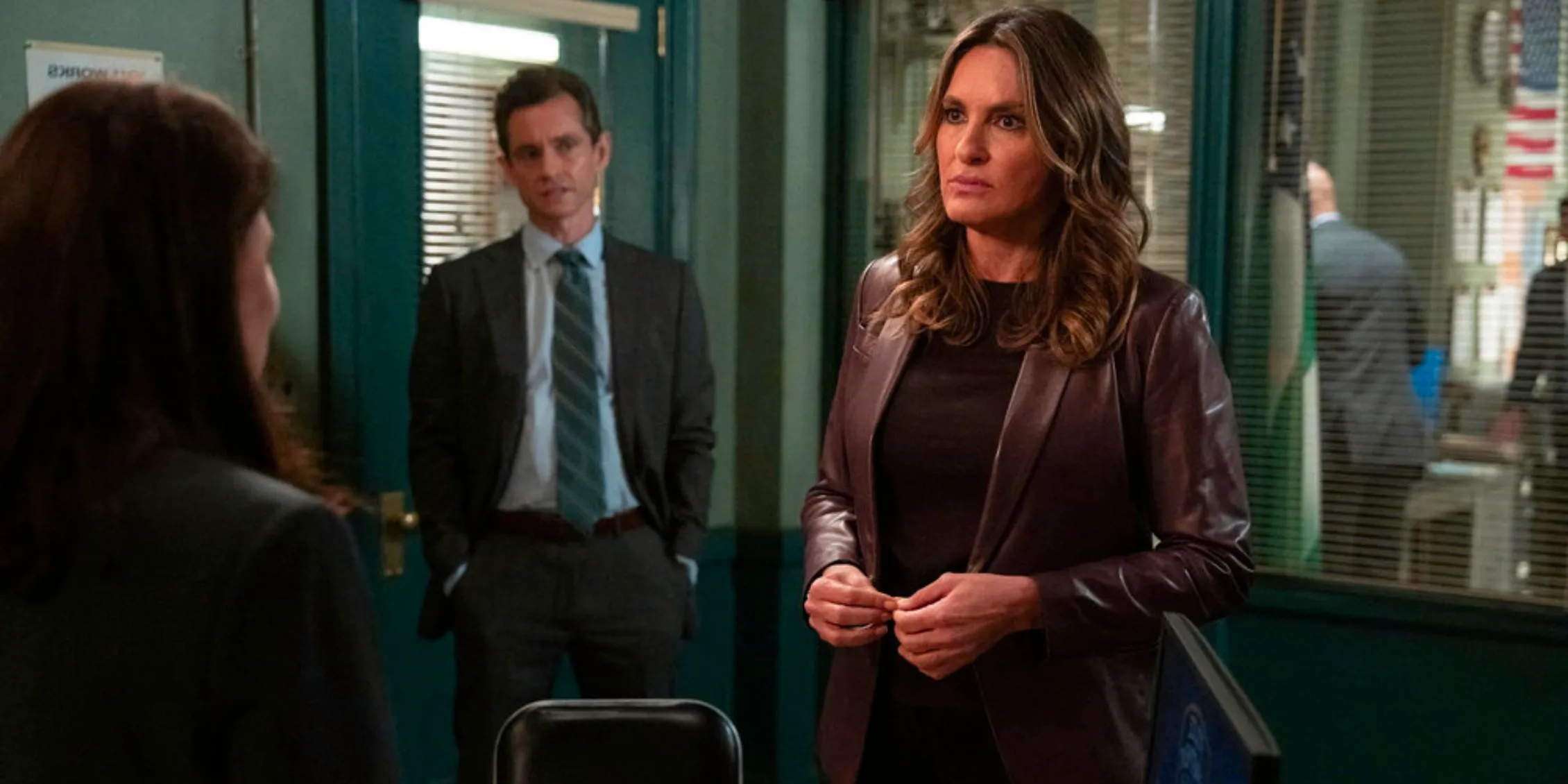 Law & Order Benson standing in the homicide office talking to Brady Image