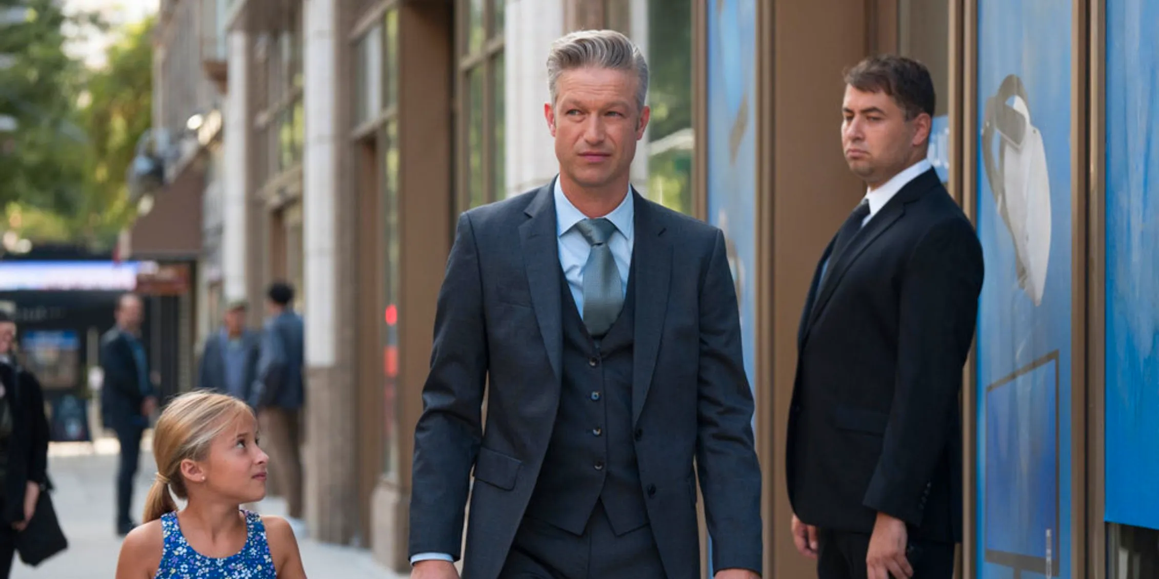 Law & Order- SVU Carisi walks with his daughter Jessie down the street, holding her hand Image