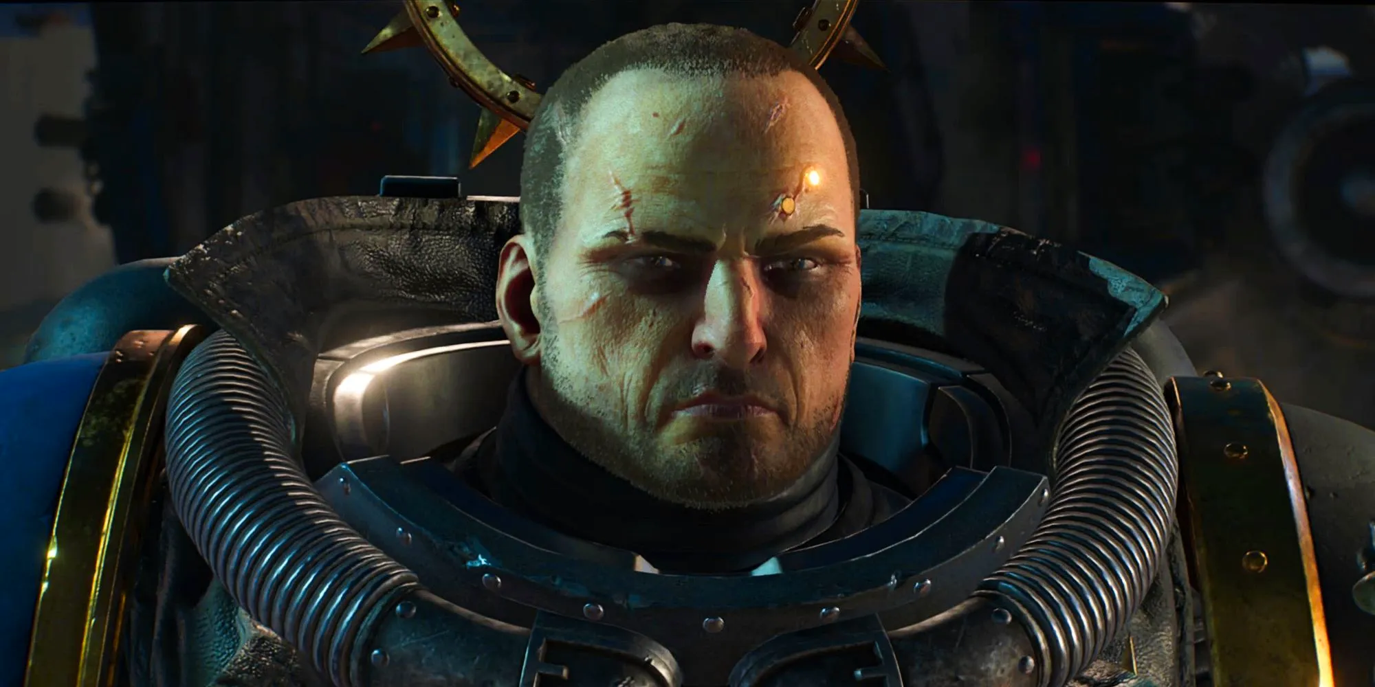 Leandros frowns in a suit of power armor in a screenshot from Warhammer 40K Space Marine 2. Image