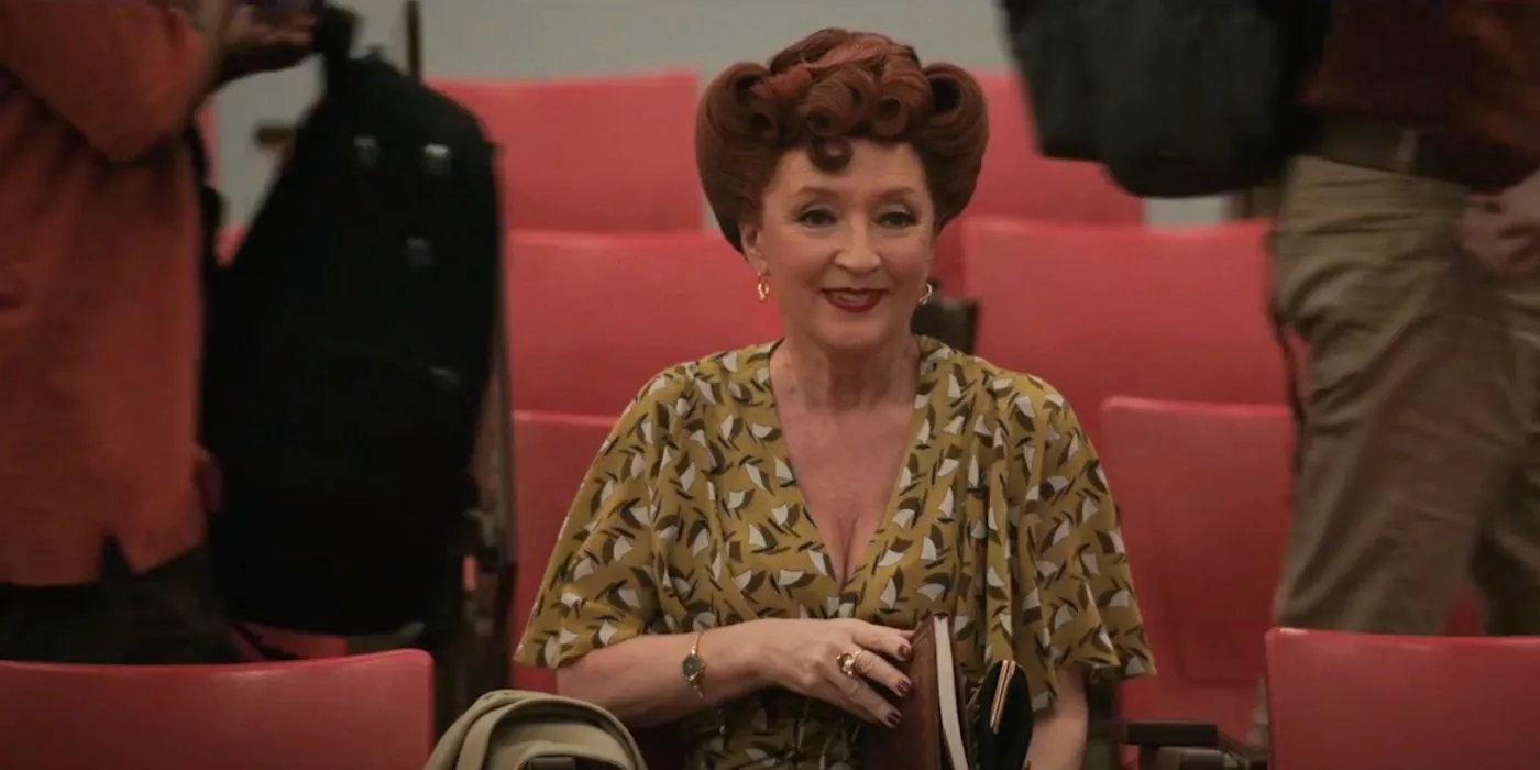 Lesley Manville's Nurse Redd smiling in class in Grotesquerie Image