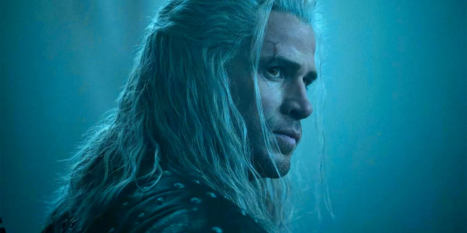 Liam Hemsworth as Geralt in The Witcher, sporting blonde hair and looking stoic.  Image