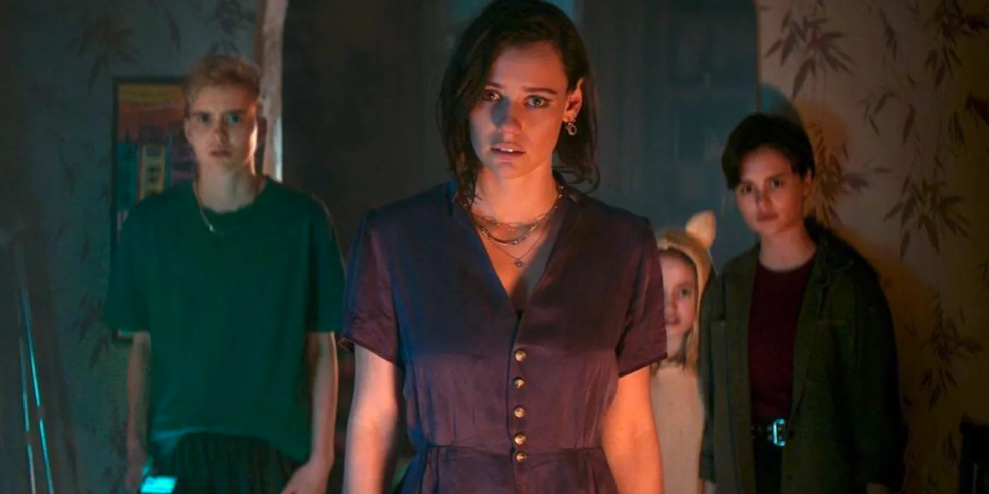 Lily Sullivan and other cast members looking worried in Evil Dead Rise. Image