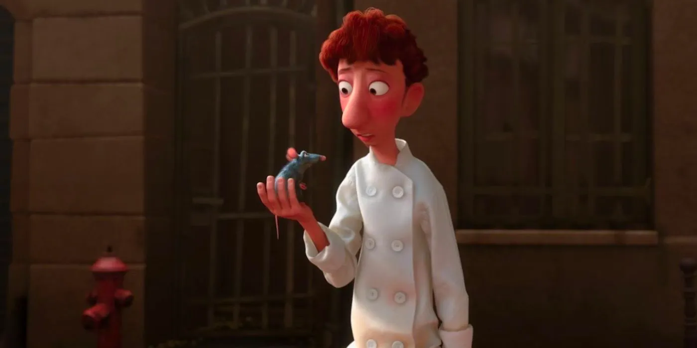 Linguini talks to Remy, holding him in his hand, in Ratatouille Image