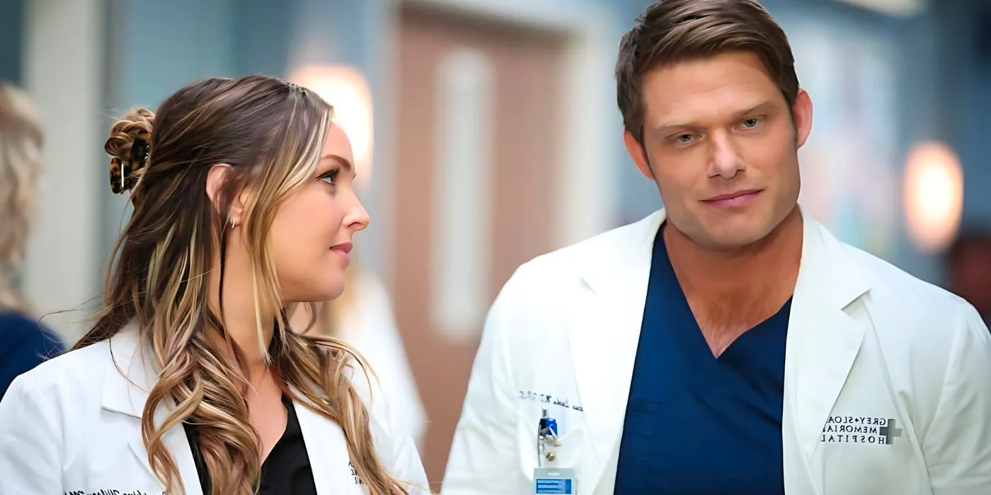 Link (Chris Carmack) and Jo Wilson (Camilla Luddington) chatting in the hall in Grey's Anatomy season 20 Image