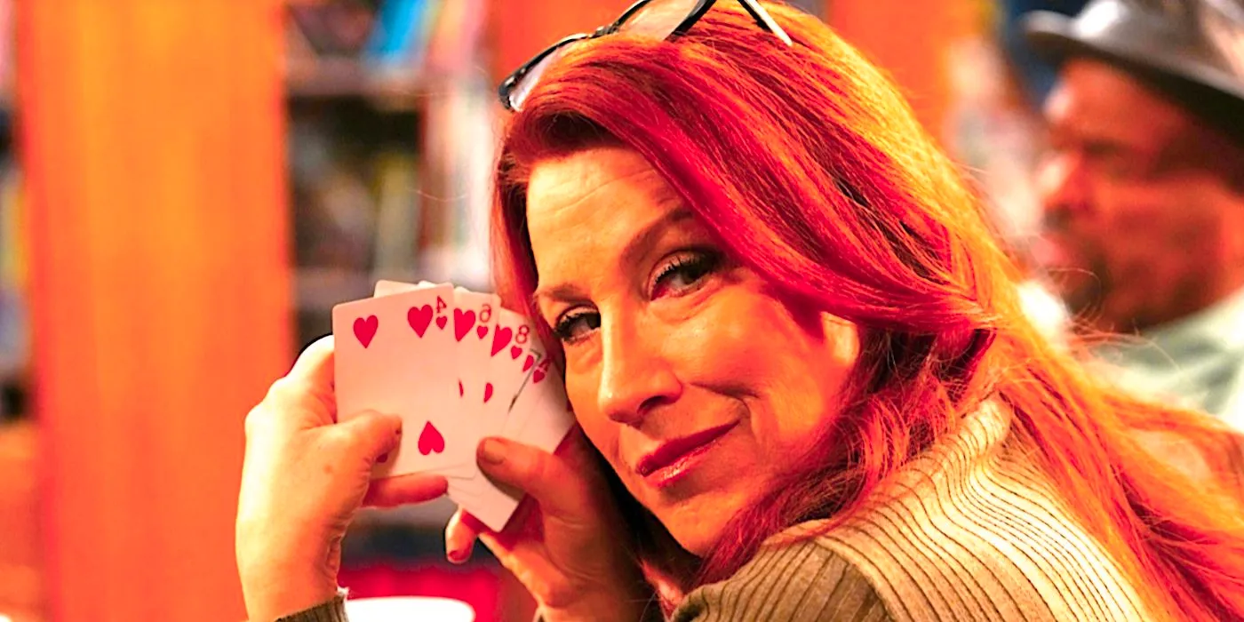 Lisa Ann Walter's Melissa shows the camera her cards during a poker game in Abbott Elementary Image