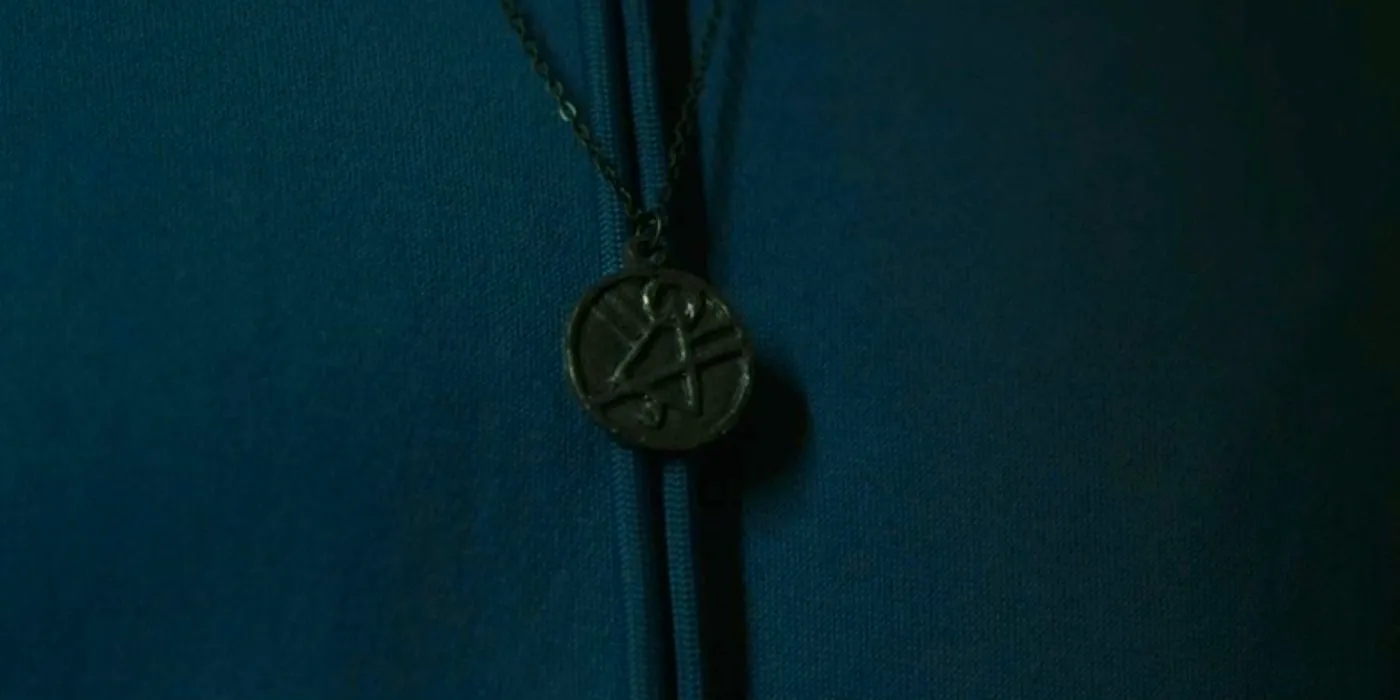 Lottie's cult symbol necklace in Yellowjackets Image