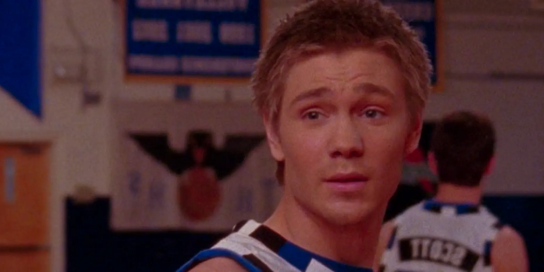 Lucas looks over his shoulder during the basketball game in the One Tree Hill season 1 finale Image