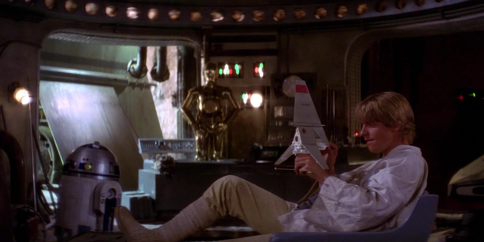 Luke Skywalker holding the Skyhopper toy in A New Hope Image