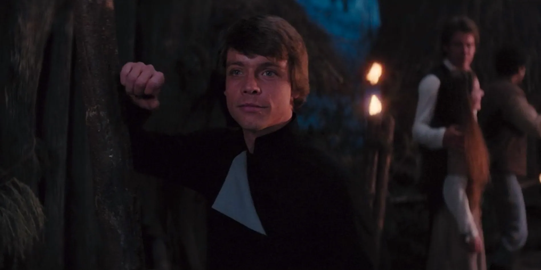 Luke Skywalker standing and smiling at the end of Return of the Jedi Image