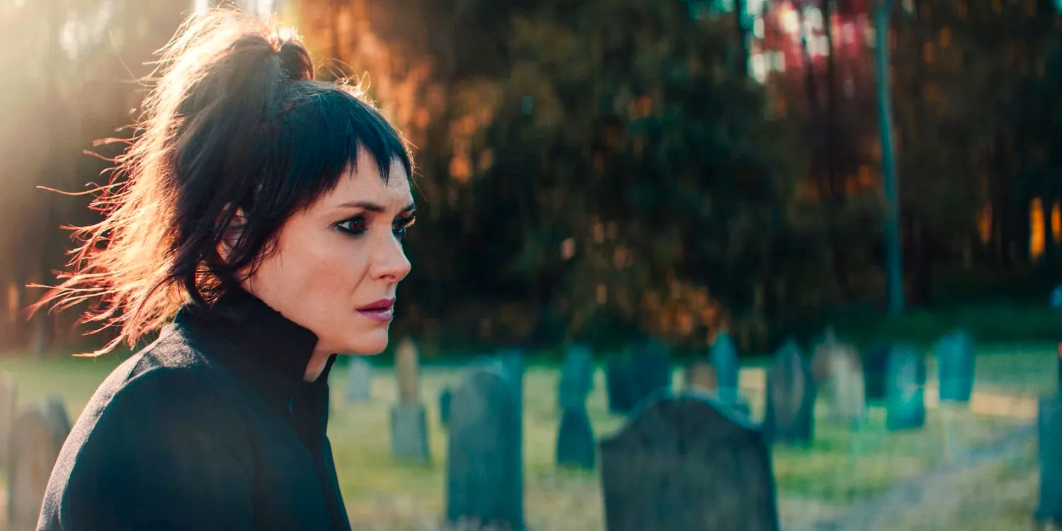 Lydia Deetz (Winona Ryder) pensive in the cemetery in Beetlejuice 2 Image