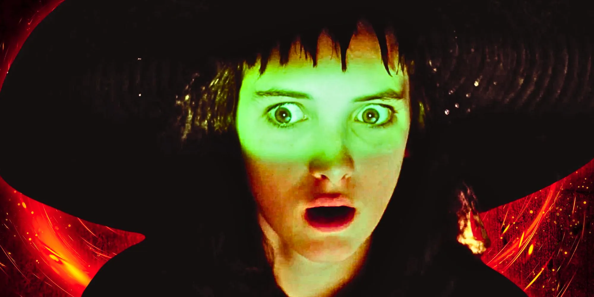 Lydia looking shocked in Beetlejuice with a red background Image