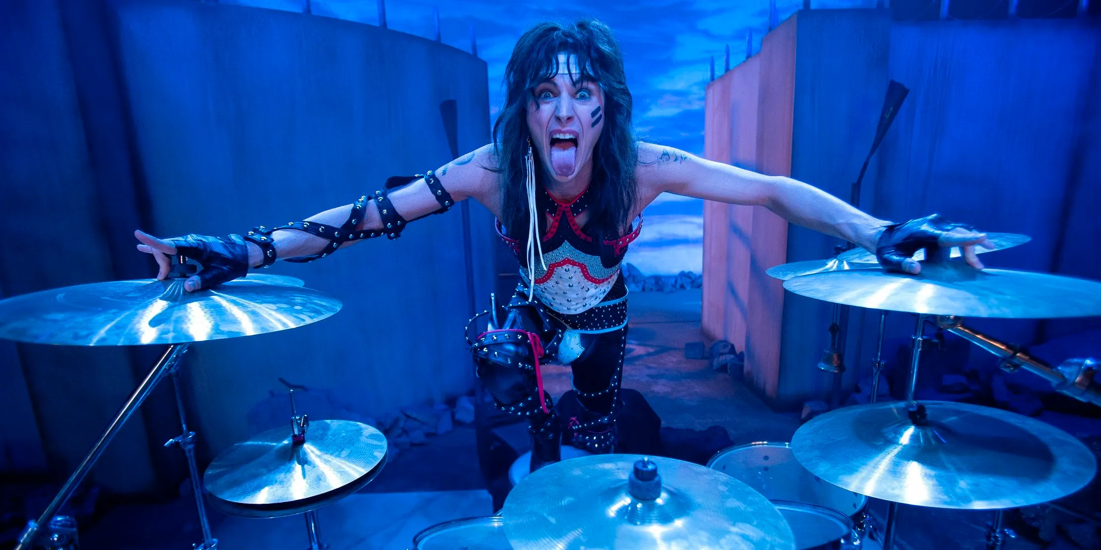 Machine Gun Kelly as Tommy Lee playing drums in The Dirt Image