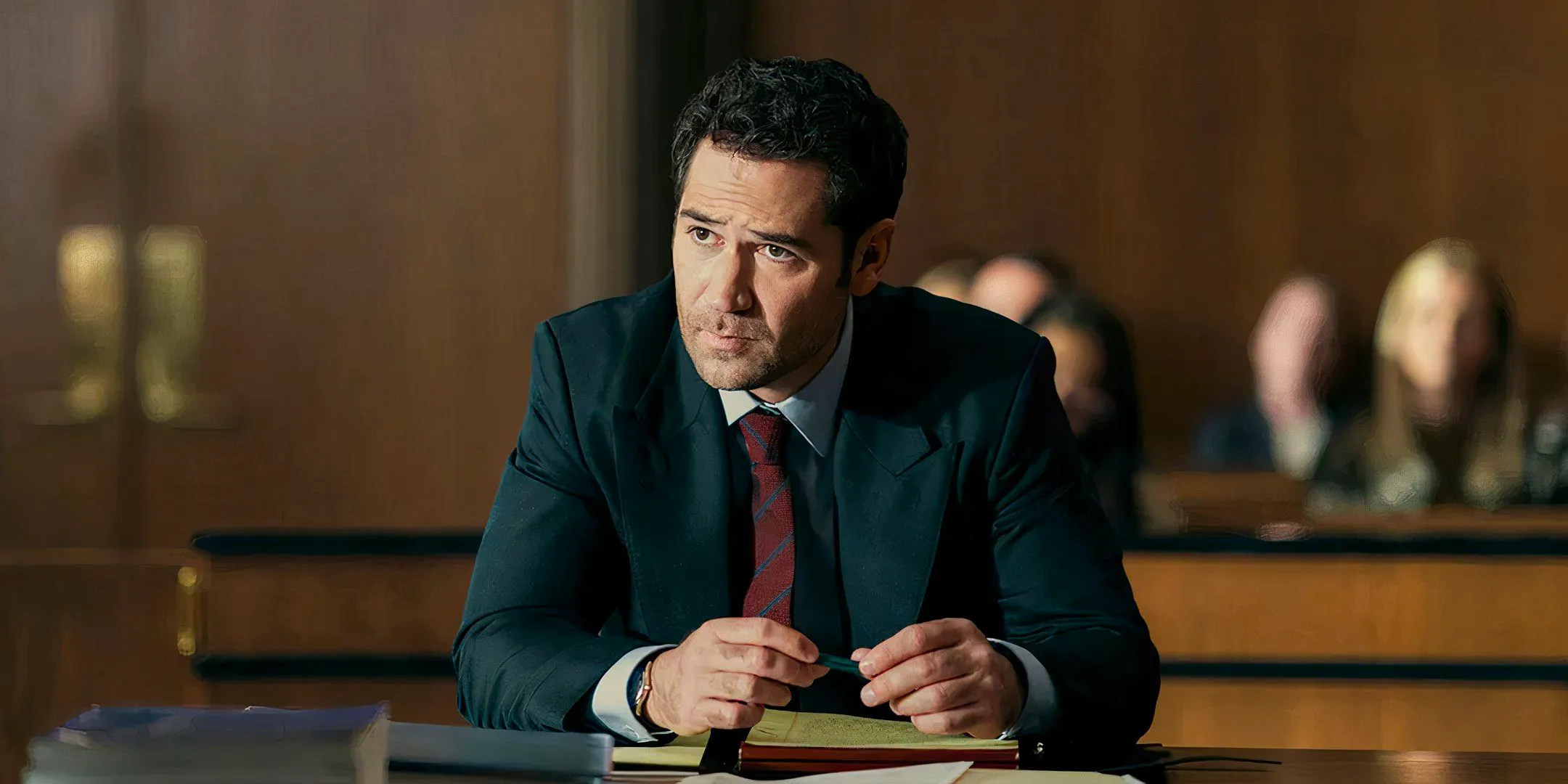 Manuel Garcia-Rulfo as Mickey looking sad in a court room in the lincoln lawyer Image